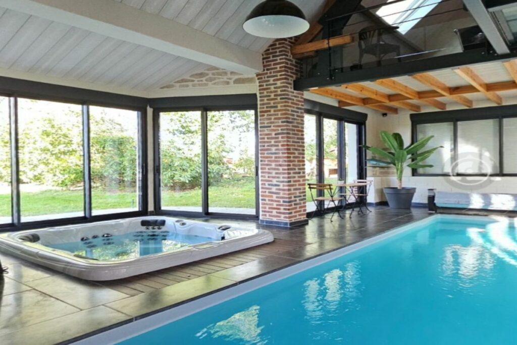 Chambre d'hôtes Ô Coeur de la grange à Lillers avec terrasse et piscine chauffée, idéale pour un séjour détente en couple